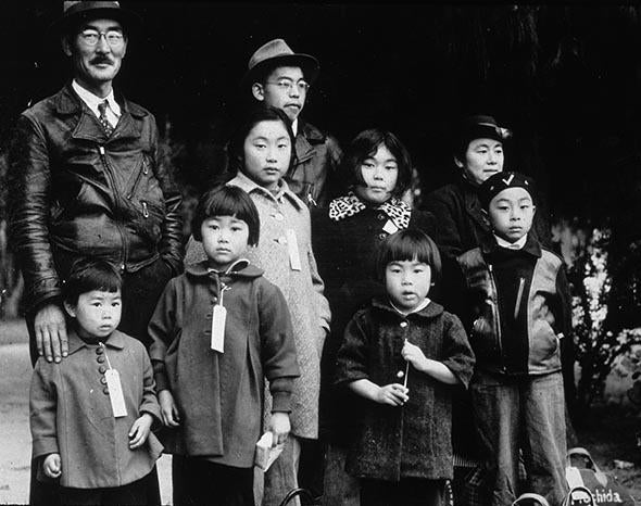 Members of the Japanese-American Mochida family awaiting re-location to a camp, Hayward, California.