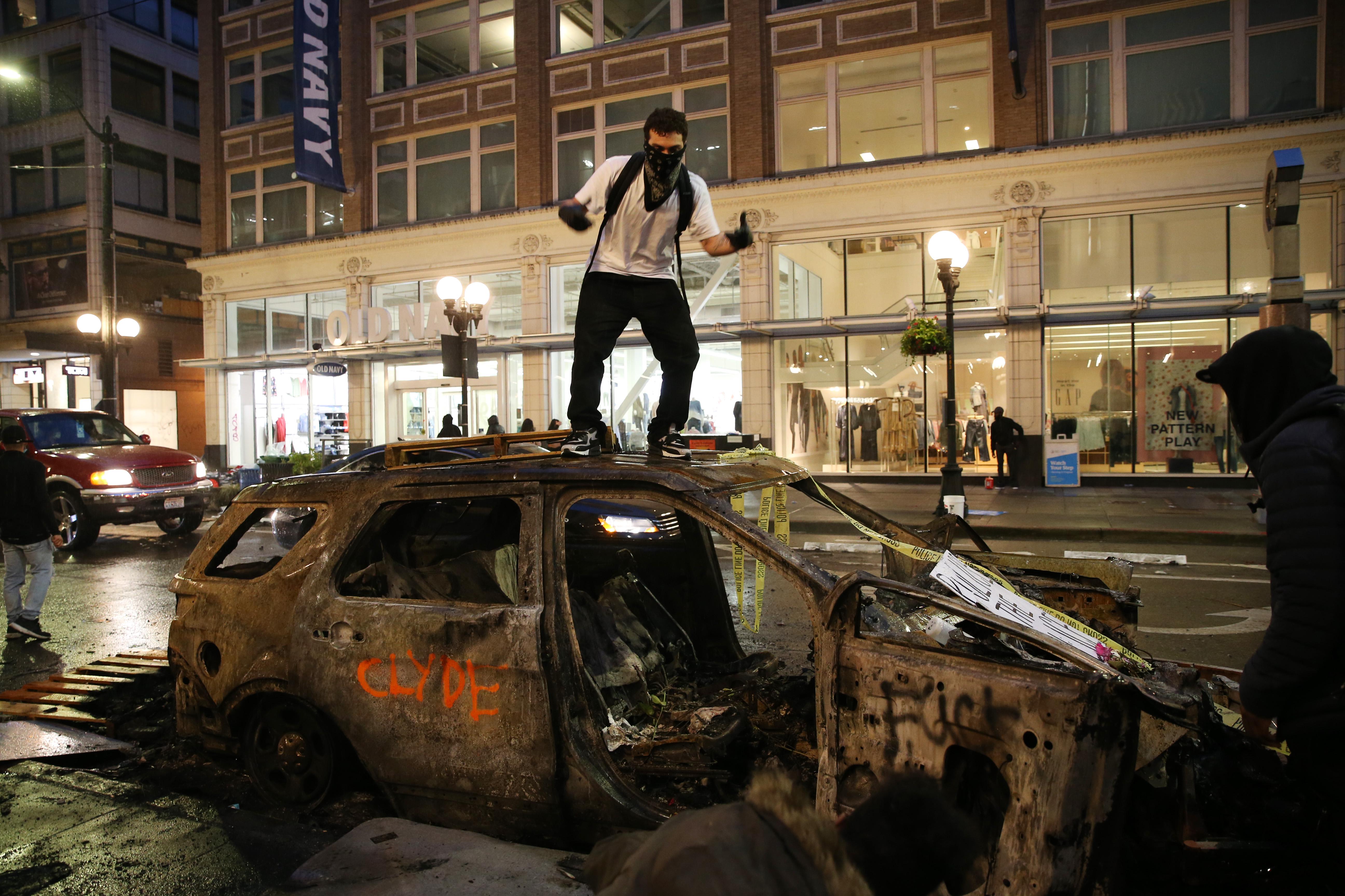Protesters riot in the streets following a peaceful rally expressing outrage over the death of George Floyd on May 30, 2020 in Seattle, Washington.