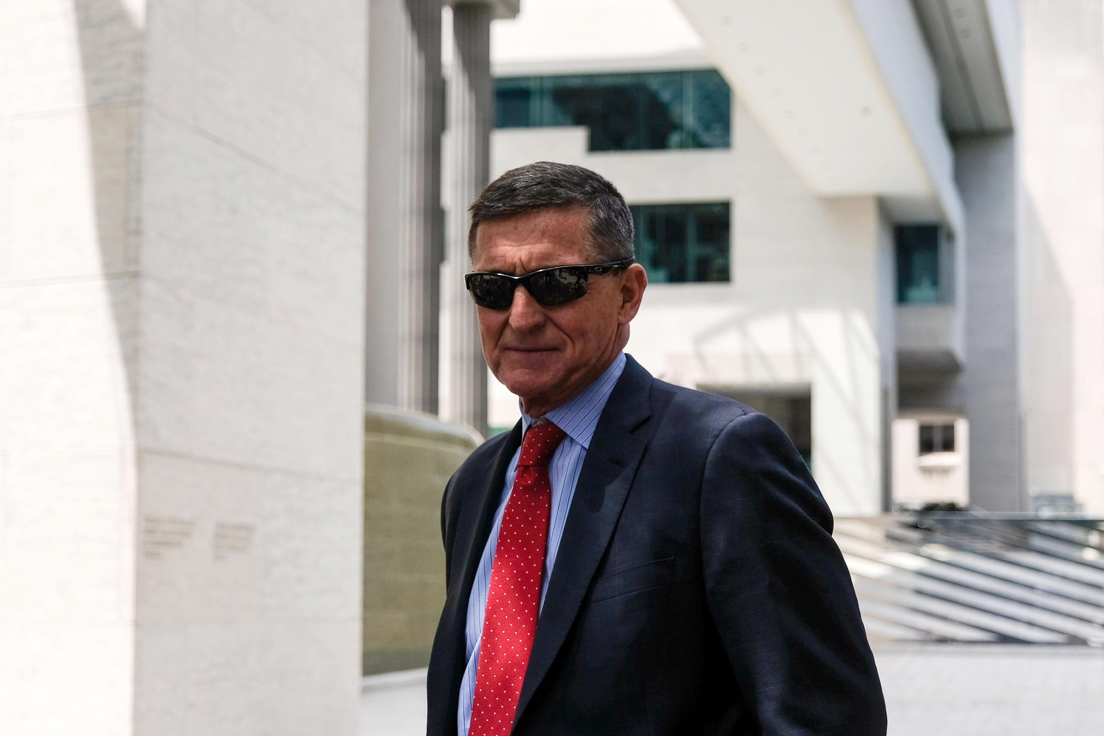 Flynn standing outside a courthouse