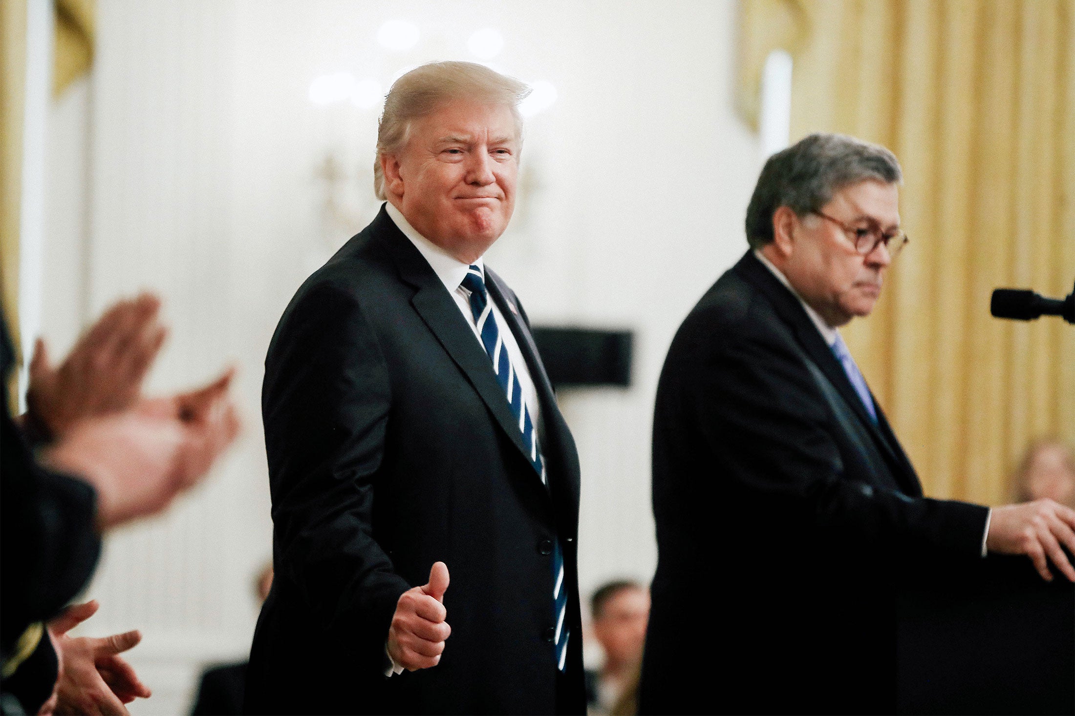President Donald Trump stands with Attorney General William Barr on May 22 in Washington.