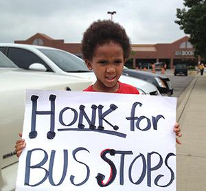 A young Dayton activist rallies for better bus service, June 2013.