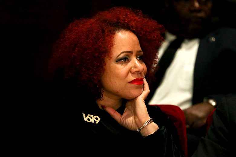 Nikole Hannah-Jones sits with her hand on the side of her face.