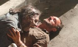 A Walker attacks Rick Grimes (Andrew Lincoln) on The Walking Dead