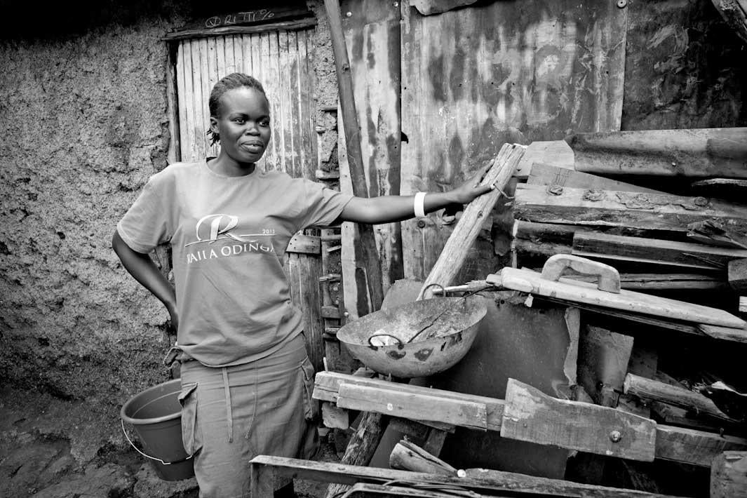 MISS HELEN:  Helen is more beautiful than she perceives herself to be.  She is one of the POHK soapsellers and was instrumental in getting our documentary photos done last July.  I LOVE this picture of her, where she appears to be the mistress of her environment.