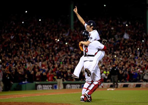 Koji Uehara, No. 19, and David Ross, No. 3, of the Boston Red Sox, celebrate after defeating the St. Louis Cardinals in Game 6 of the 2013 World Series on Oct. 30, 2013.