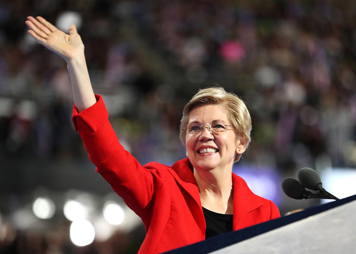 Sen. Elizabeth Warren acknowledges the crowd as she walks on stage to deliver remarks on the first day of the Democratic National Convention at the Wells Fargo Center, July 25, 2016 in Philadelphia, Pennsylvania.