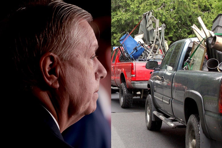 Lindsey Graham looks at a line of pickup trucks.