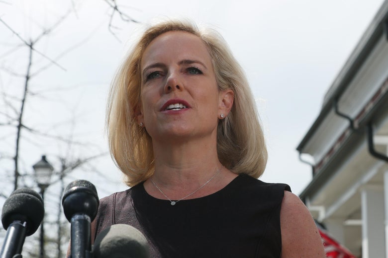 Kirstjen Nielsen speaks at a mic outside her house.