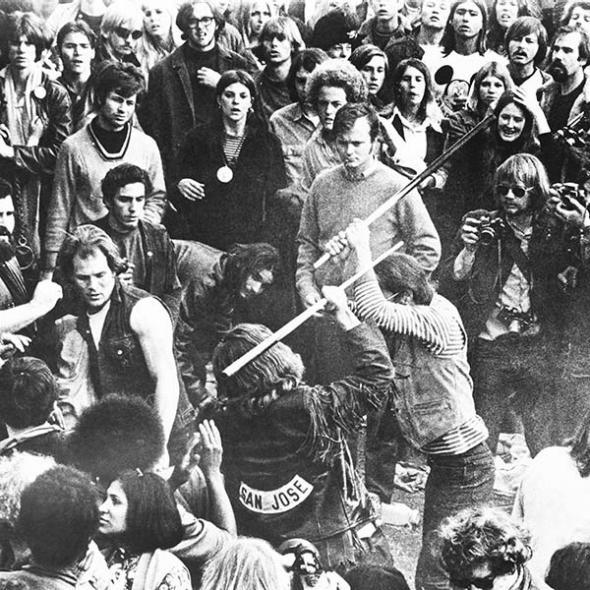 The legendary motorcycle group Hell's Angels fight with pool cues during the Altamont Free Concert. 
