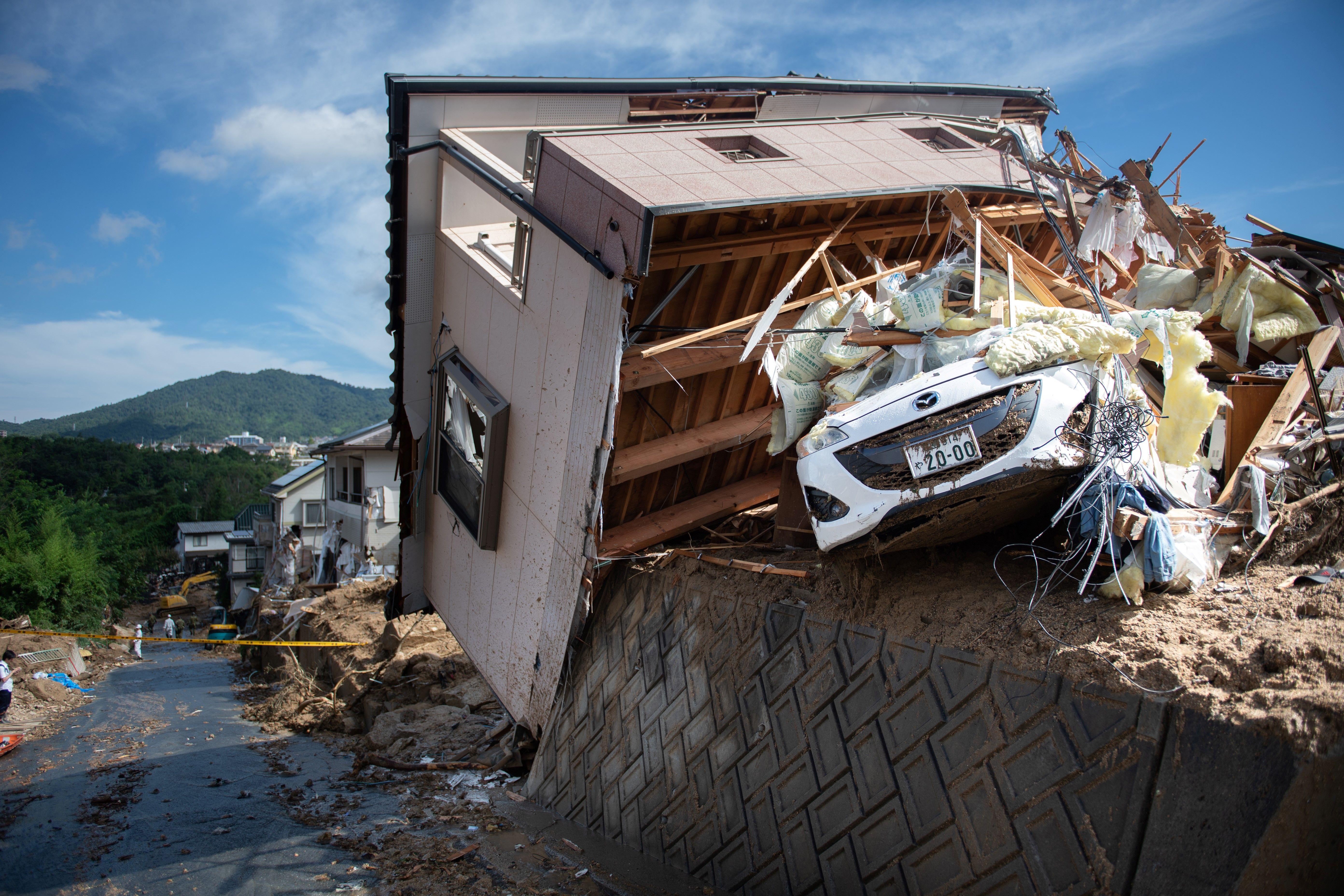 Japan floods: Widespread death and damage reported, and rescues