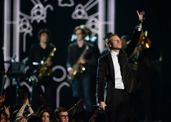 Macklemore performs the song "Same Love" at the 56th Grammy Awards at the Staples Center in Los Angeles, California, January 26, 2014. 