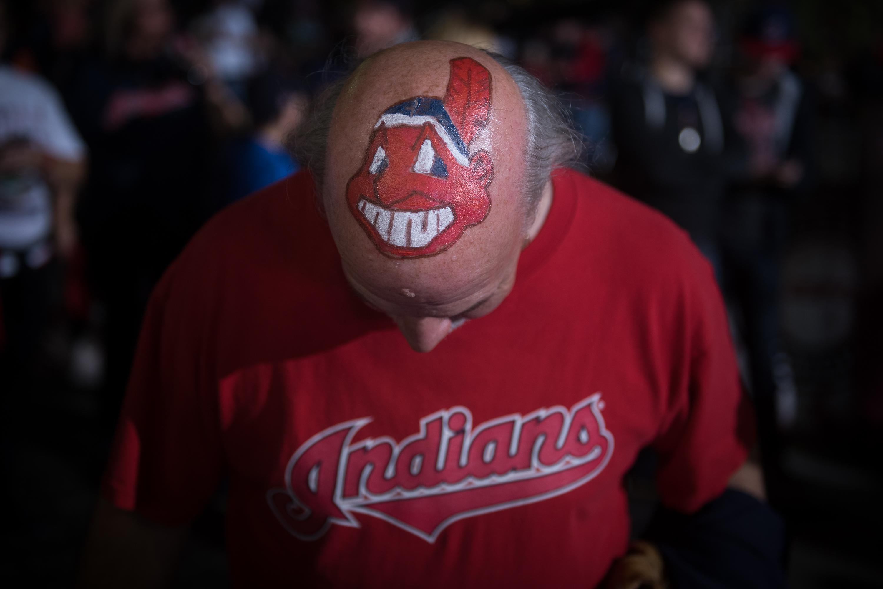 A fan shows off his Cleveland Indians mascot-painted head prior to game 6 of the World Series against the Chicago Cubs on November 1, 2016 in Cleveland, Ohio.