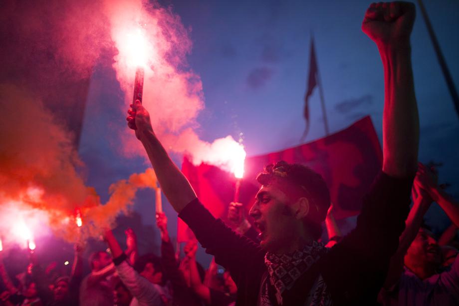 Protesters light torches in Taksim Square on June 4, 2013 in Istanbul, Turkey.