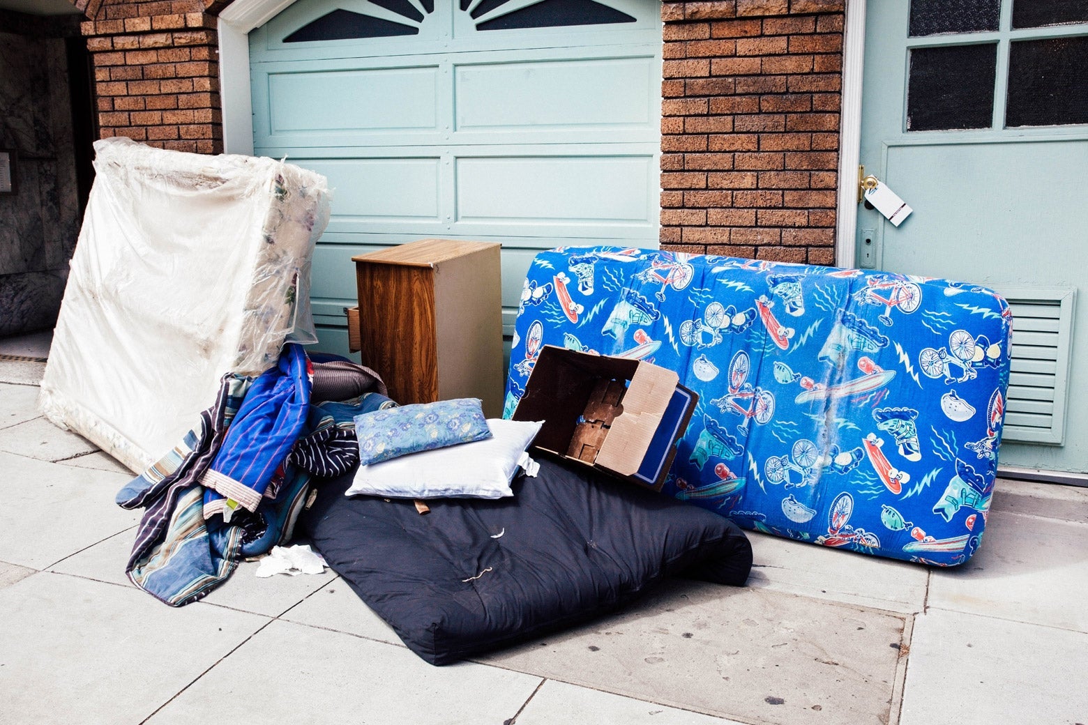A mattress and other personal items outside a home following an eviction.