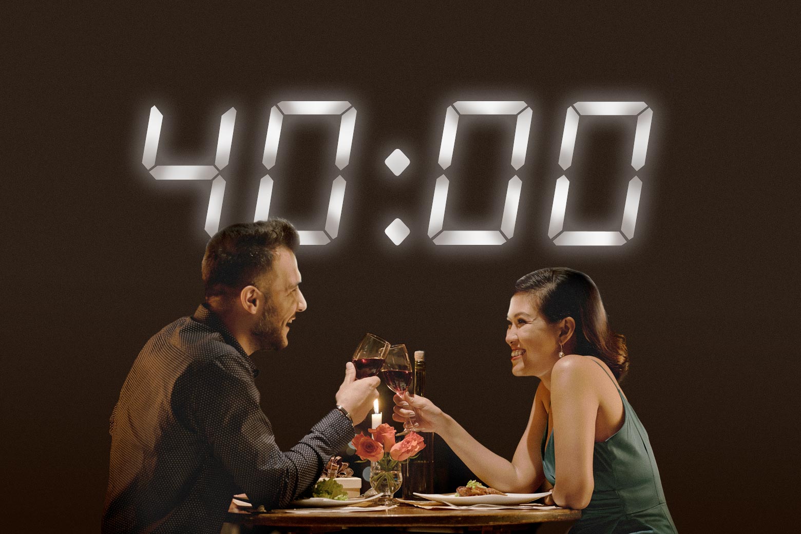 Two people having dinner with a big timer that says "40:00" above them.