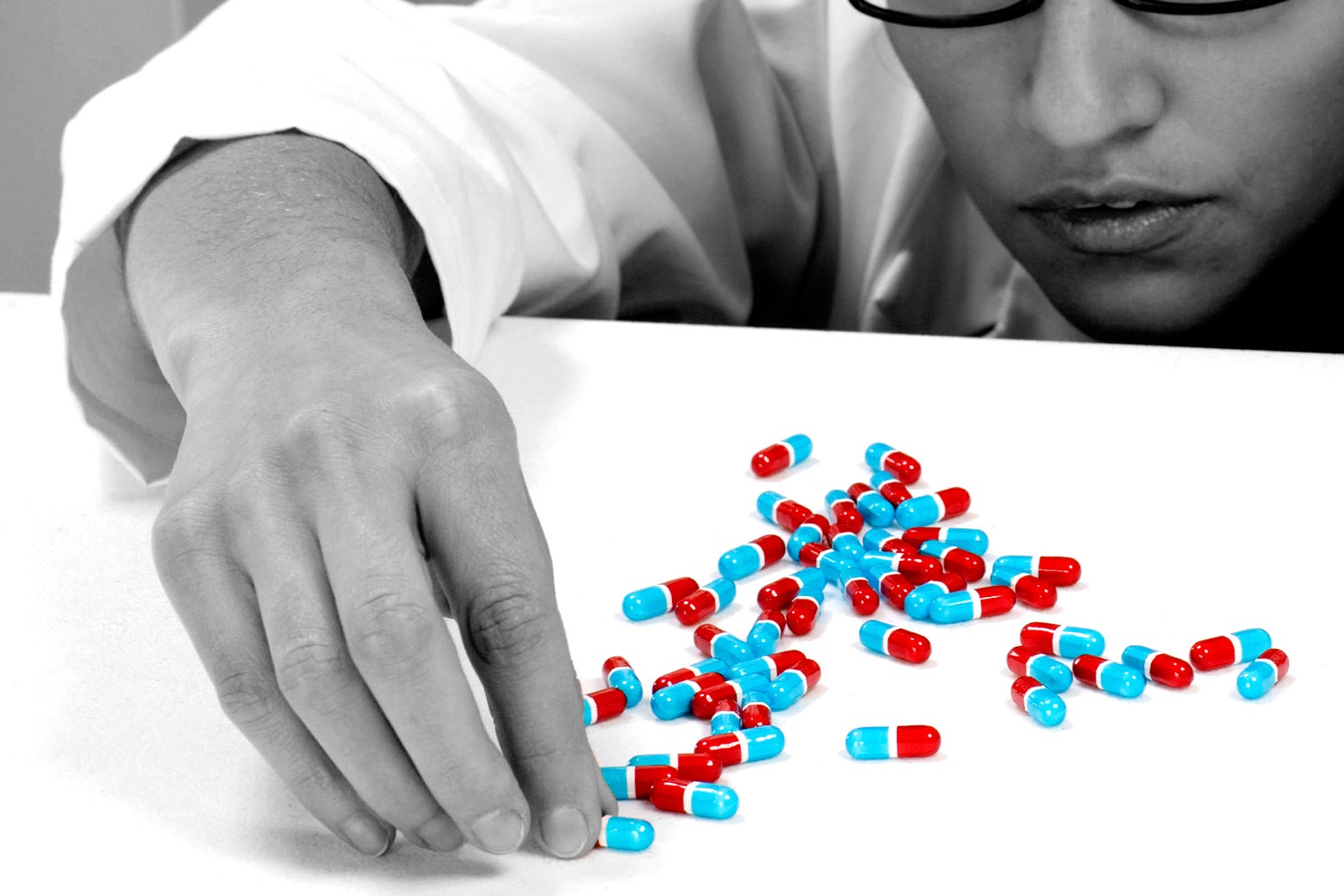 A pharmacist counting pills.