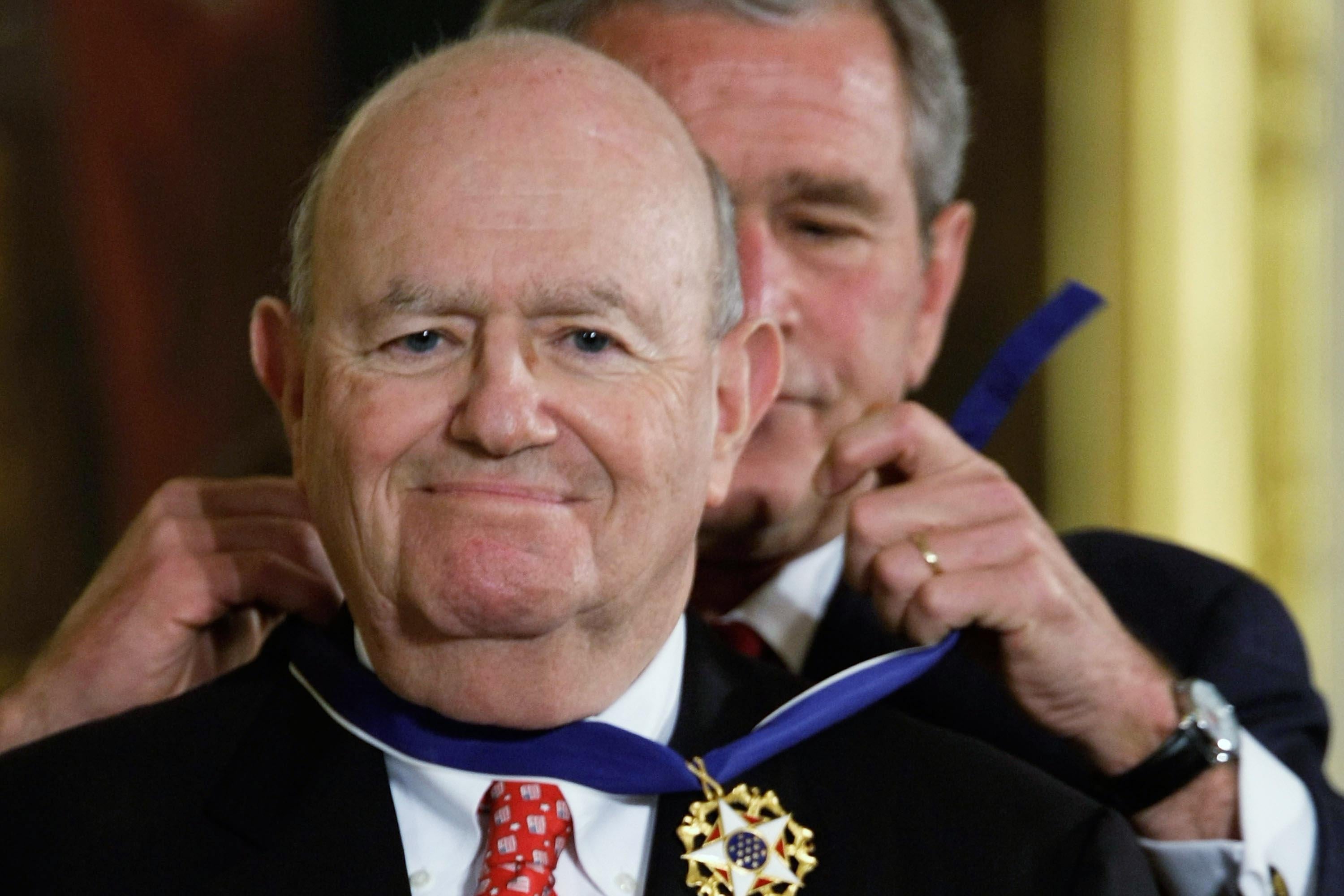 Laurence Silberman smiles while George W. Bush places the Presidential Medal of Freedom around his neck.