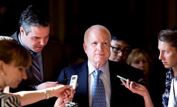 Sen. John McCain (R-AZ) talks with reporters as he walks to a Senate joint caucus meeting, on Capitol Hill.