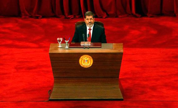 President Mohamed Morsi delivers a speech at Cairo's University after being sworn-in at the Constitutional Court in Cairo, on June 30, 2012.