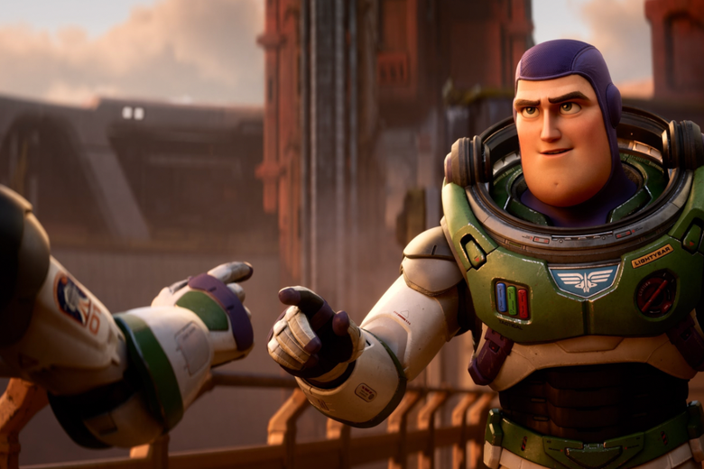 A still shows Buzz Lightyear point to a character off screen, who appears to be pointing back with a hand in the same space suit