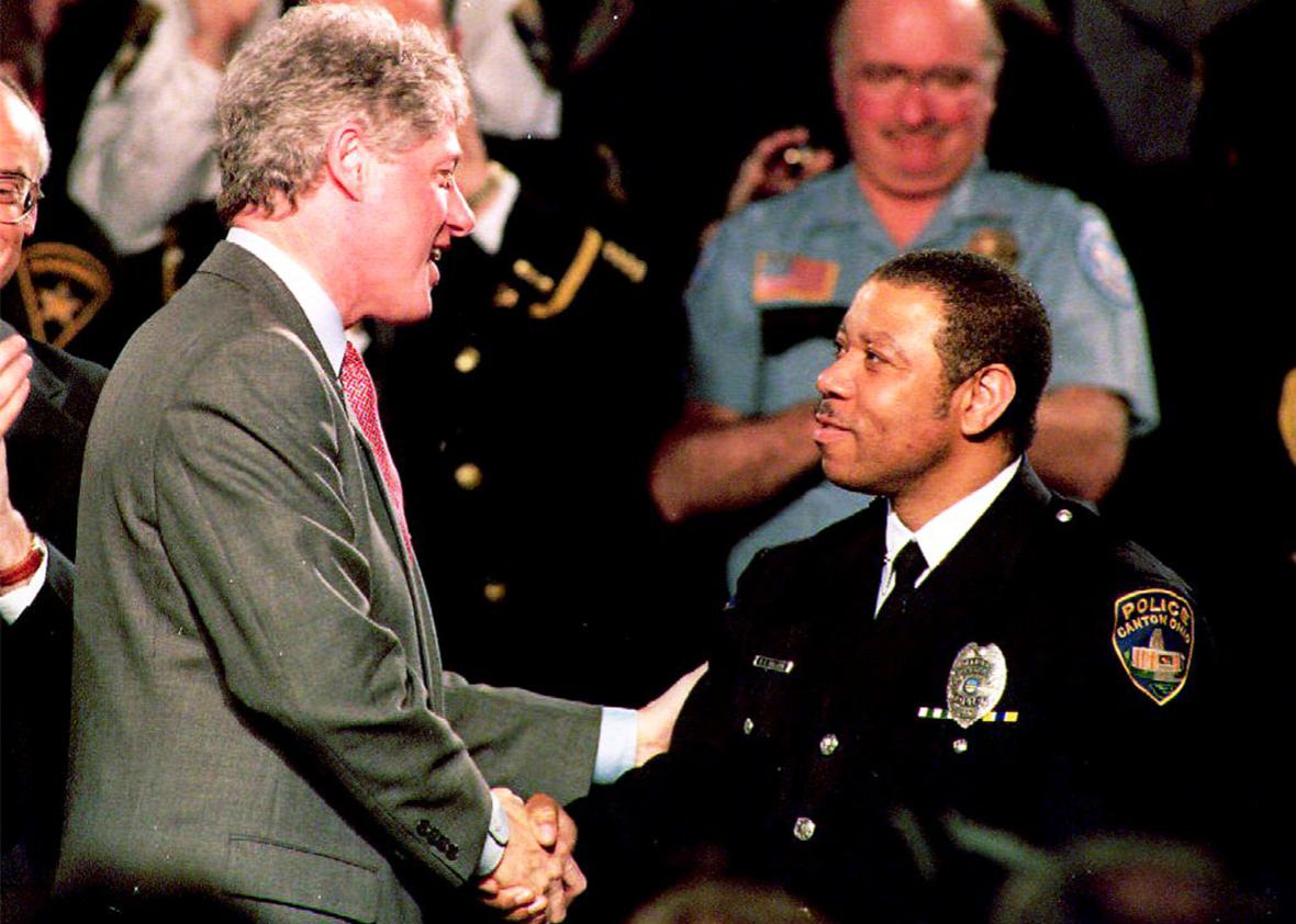President Bill Clinton shakes hands with Ray Skillern, a 12-year veteran of the Canton, Ohio, police force in February 1994.