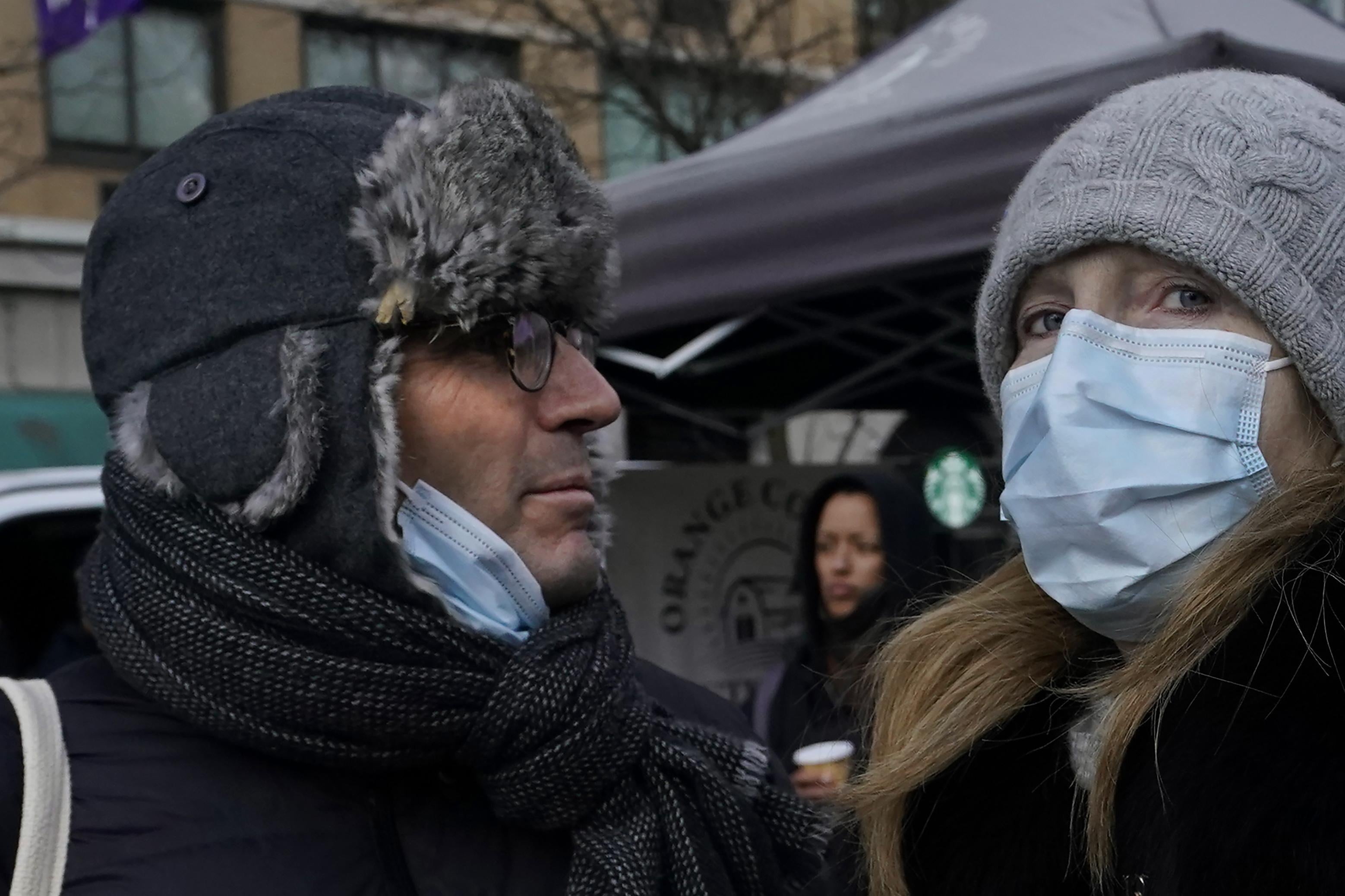 Tourists wearing masks  walk through Union Square in New York City on February 28, 2020, amid fears of the coronavirus and a global pandemic. - The World Health Organization raised its global risk assessment of the new coronavirus to its highest level after the epidemic spread to sub-Saharan Africa and caused financial markets to plunge. (Photo by TIMOTHY A. CLARY / AFP) (Photo by TIMOTHY A. CLARY/AFP via Getty Images)