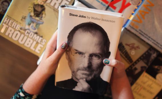 Alison Weiss looks at a copy of the newly released biography of Apple co-founder and former CEO Steve Jobs at the Books & Books store.,130302364JR001_ANTICIPATED_