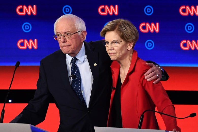 Democratic presidential hopefuls Sen. Bernie Sanders and Sen. Elizabeth Warren hug after participating in the first round of the second Democratic primary debate of the 2020 presidential campaign season in Detroit, Michigan on July 30, 2019.