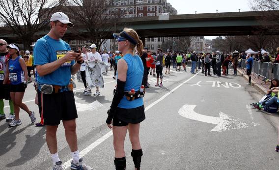 Boston Marathon runner on cell phone