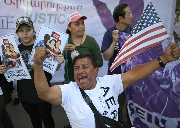 A man chants during an immigration rally on May 1, 2014, in Los Angeles.