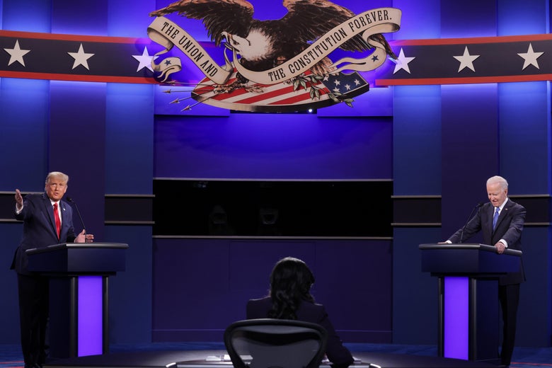 Donald Trump and Joe Biden stand at their lecterns on the debate stage.