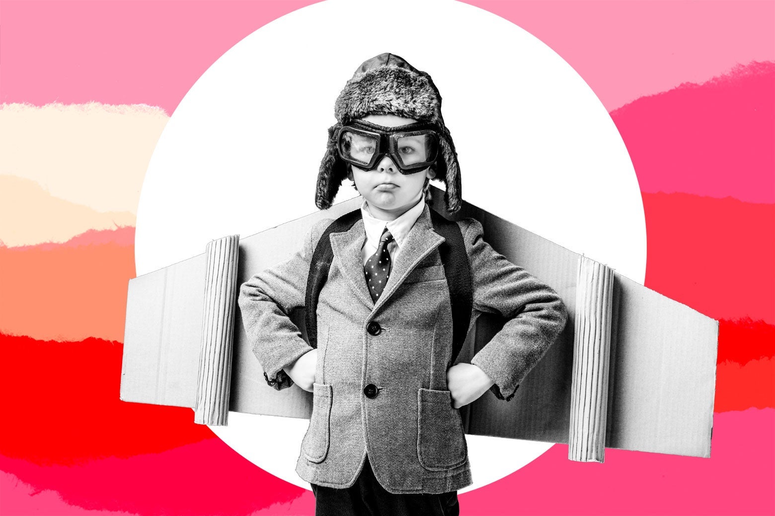 Photo illustration of a young boy wearing cardboard wings and pilot goggles.