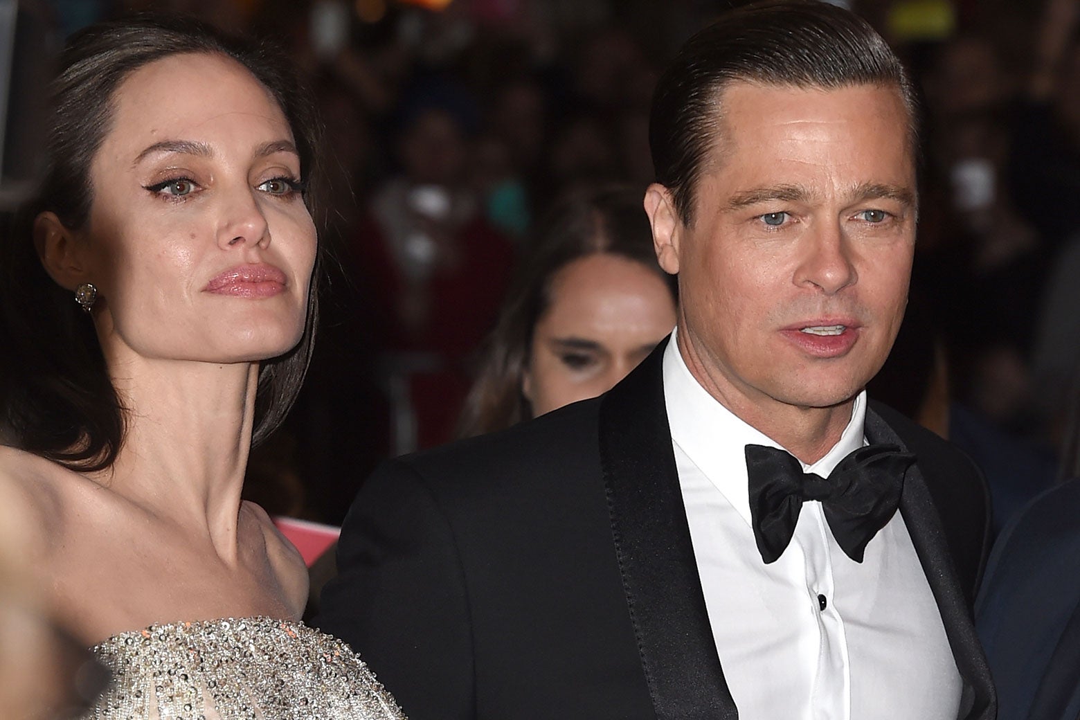 Angelina Jolie in a beaded strapless gown and Brad Pitt in a tuxedo.