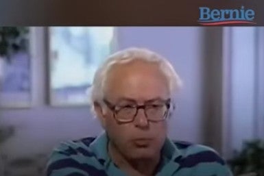 Screenshot of video of Bernie Sanders speaking on TV in 1995, wearing a striped polo shirt.