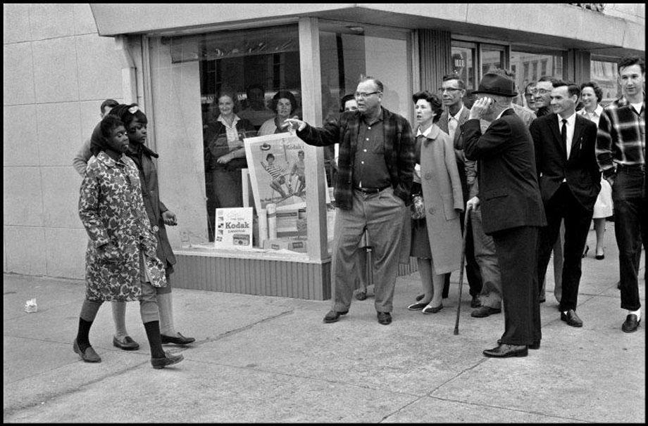 Magnum photographers document progess of blacks, women, and gay rights.