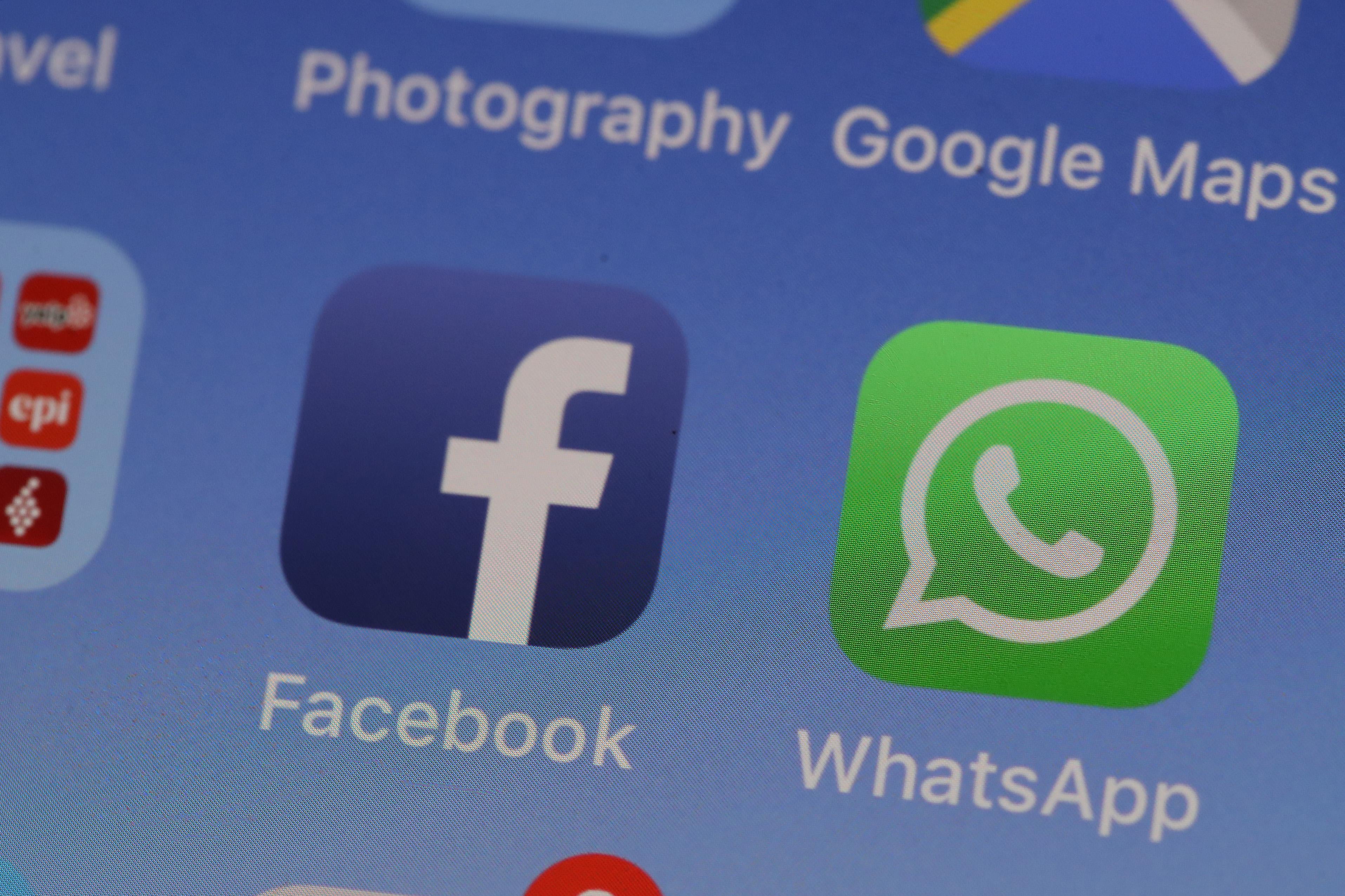 The Facebook and WhatsApp applications are displayed on an Apple iPhone on May 14, 2019 in San Anselmo, California.