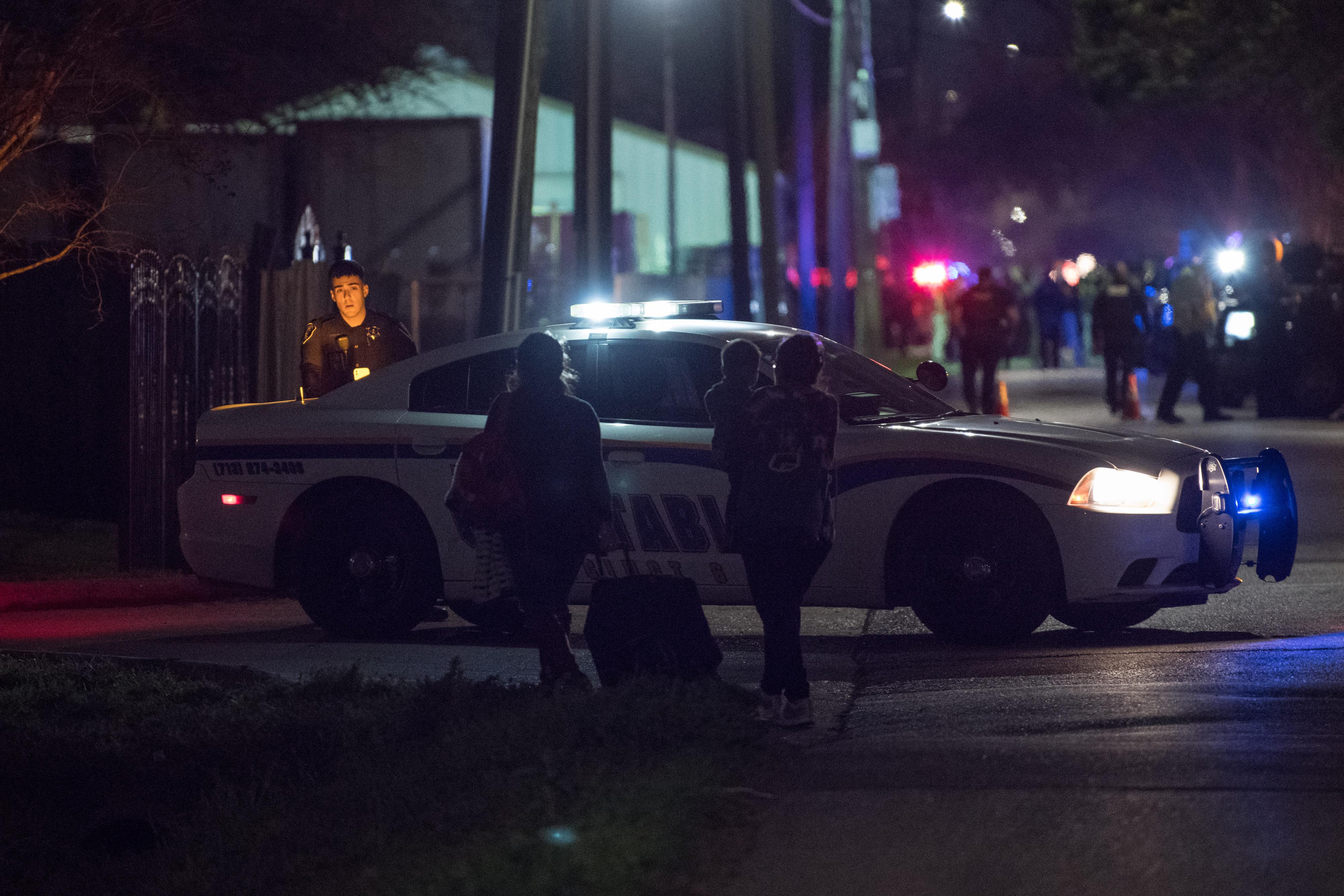Local residents try to reach their homes near the scene of a shooting where four Houston police officers were reported shot January 28, 2019 in Houston, Texas.