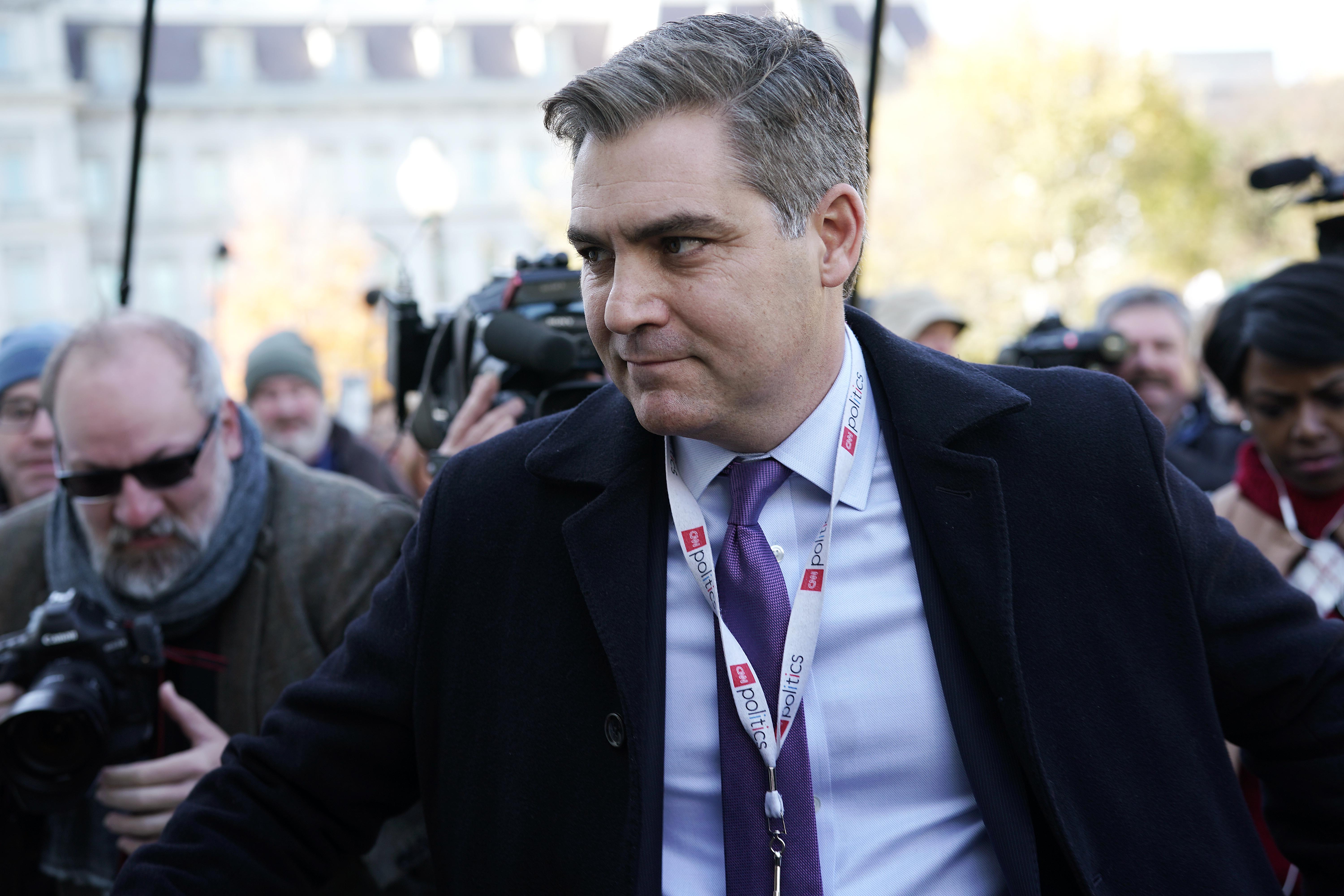 CNN reporter Jim Acosta entering the White House after having his press access restored