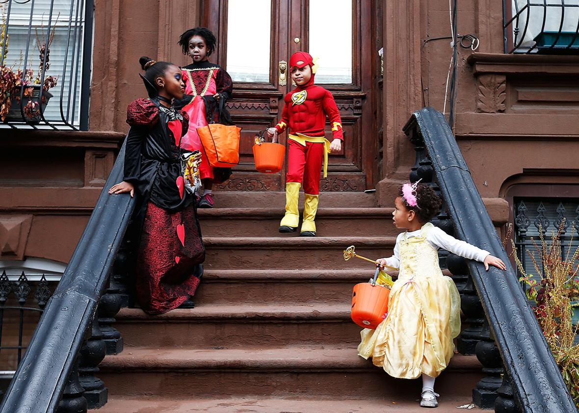 Children of the Jefferson Village Block Association "Trick or Treat" at local residences in Bedford Stuyvesant, Brooklyn on October 31, 2013 in New York City.  