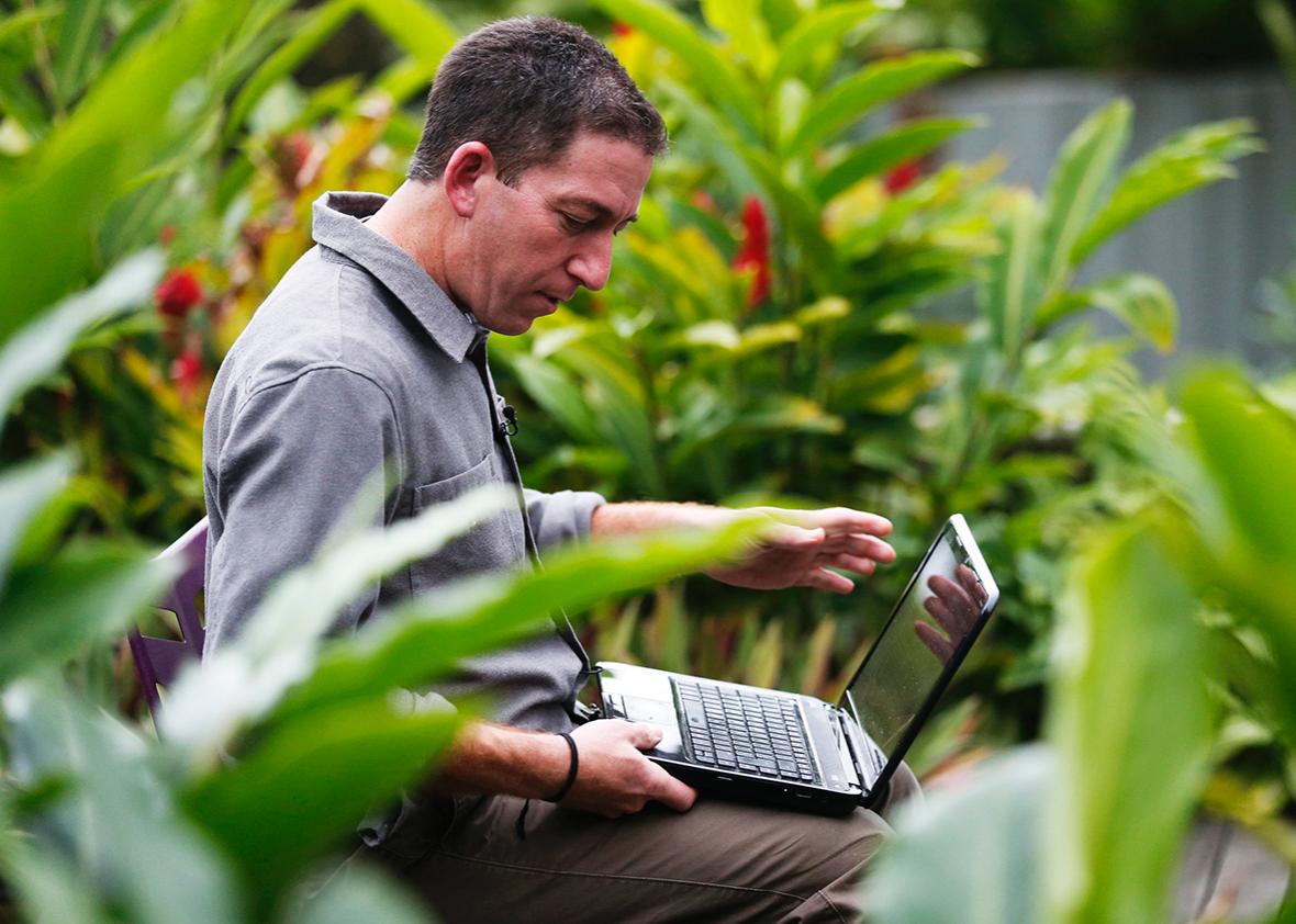Glenn Greenwald, the blogger and journalist who broke the U.S. National Security Agency surveillance scandal, uses his laptop before an exclusive interview with Reuters in Rio de Janeiro July 9, 2013. 