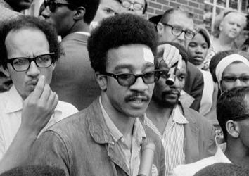 American civil rights activist H. Rap Brown speaks to a crowd of reporters, 1967.