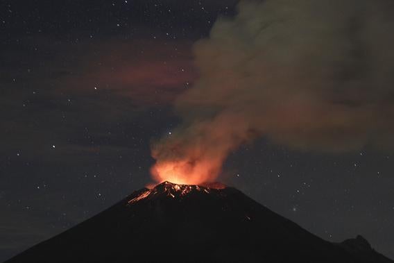 Smoke rises from the Popocatepetl as it spews incandescent volcanic material on the outskirts of Puebla.