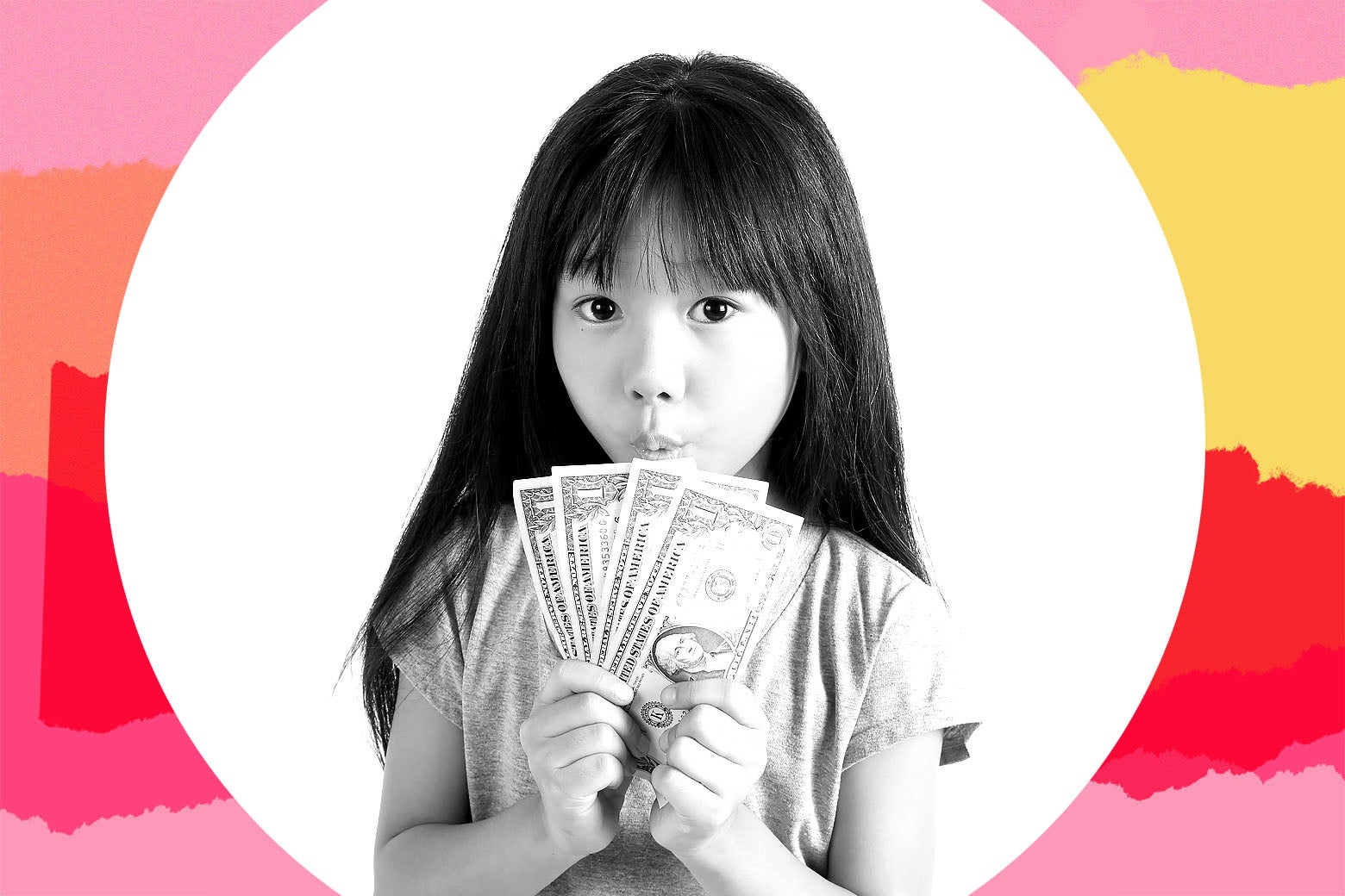 A child holds a fan of one dollar bills.