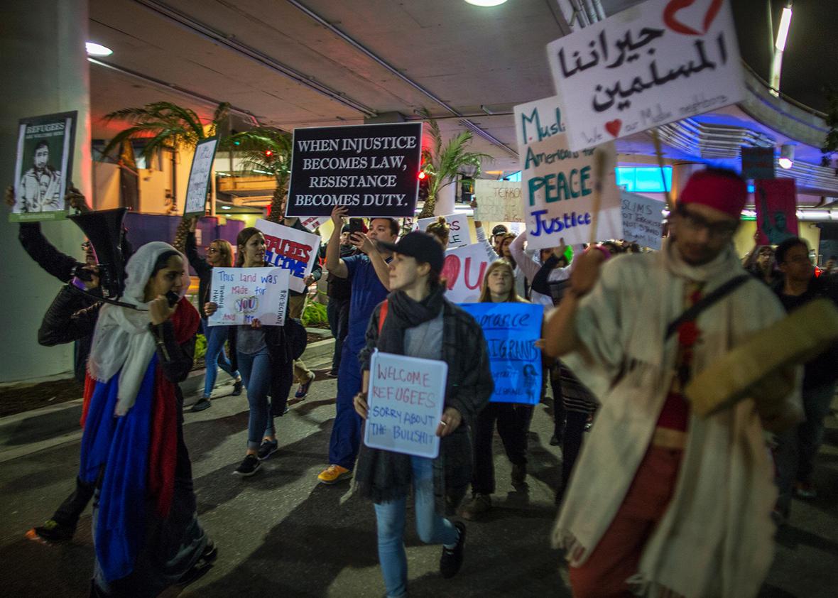 Demonstrators march in support of a ruling by a federal judge in Seattle that grants a nationwide temporary restraining order against the presidential order to ban travel to the United States from seven Muslim-majority countries, inside the Tom Bradley International Terminal at Los Angeles International Airport on February 4, 2017 in Los Angeles, California.