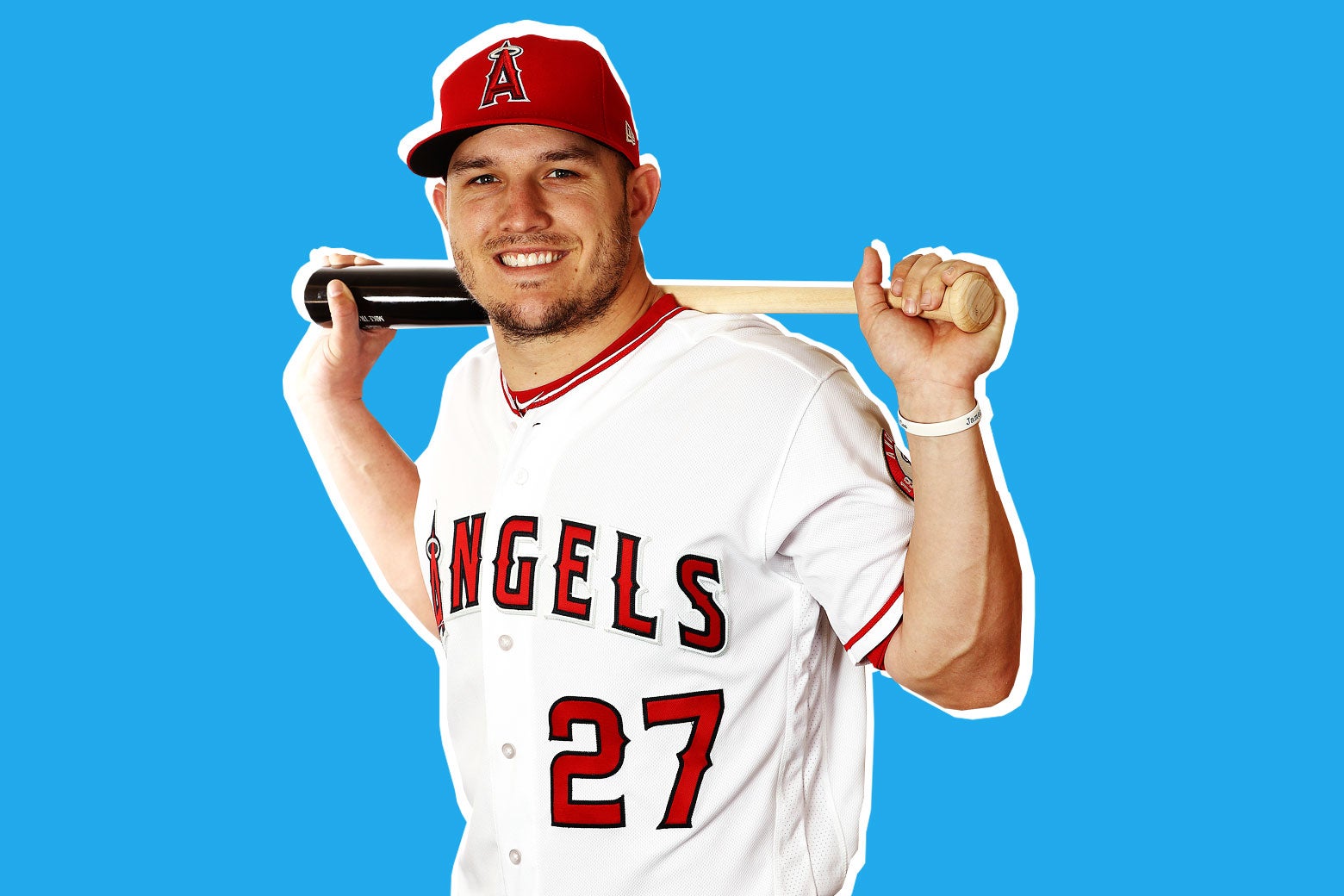 Photo illustration of Mike Trout, No. 27 for the Los Angeles Angels, posing with a baseball bat slung over the back of his shoulders while he smiles winningly at the camera.