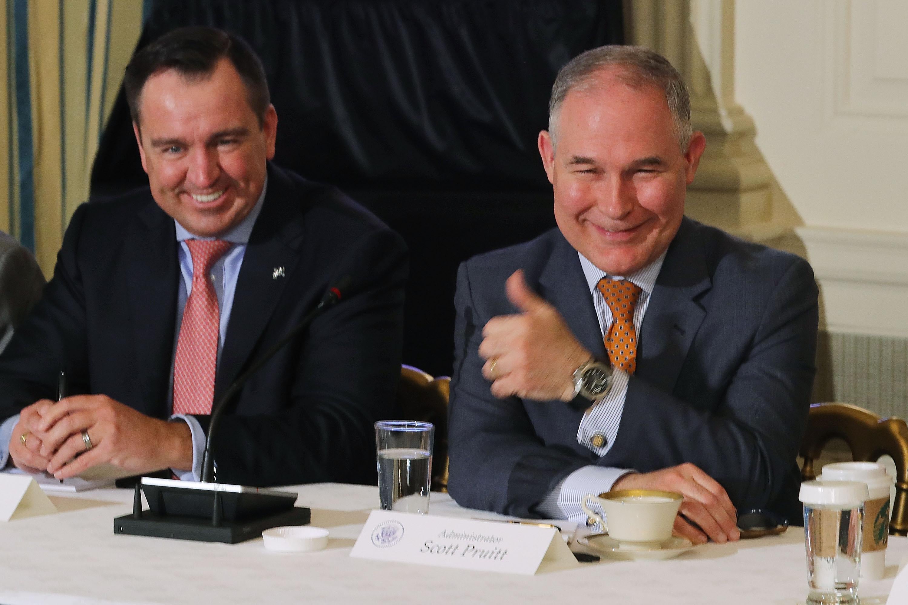 WASHINGTON, DC - FEBRUARY 12:  Environmental Protection Agency Administrator Scott Pruitt (R) gives a thumbs-up during a meeting with Utah Speaker of the House Greg Hughes and other state and local leaders where U.S. President Donald Trump unveiled his administration's long-awaited infrastructure plan in the State Dining Room at the White House February 12, 2018 in Washington, DC. The $1.5 trillion plan to repair and rebuild the nation's crumbling highways, bridges, railroads, airports, seaports and water systems is funded with $200 million in federal money with the remaining 80 percent coming from state and local governments.  (Photo by Chip Somodevilla/Getty Images)