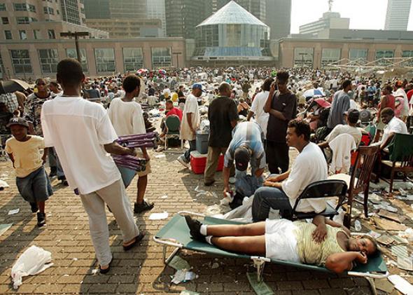 Stranded victims of Hurricane Katrina wait outside the Superdome