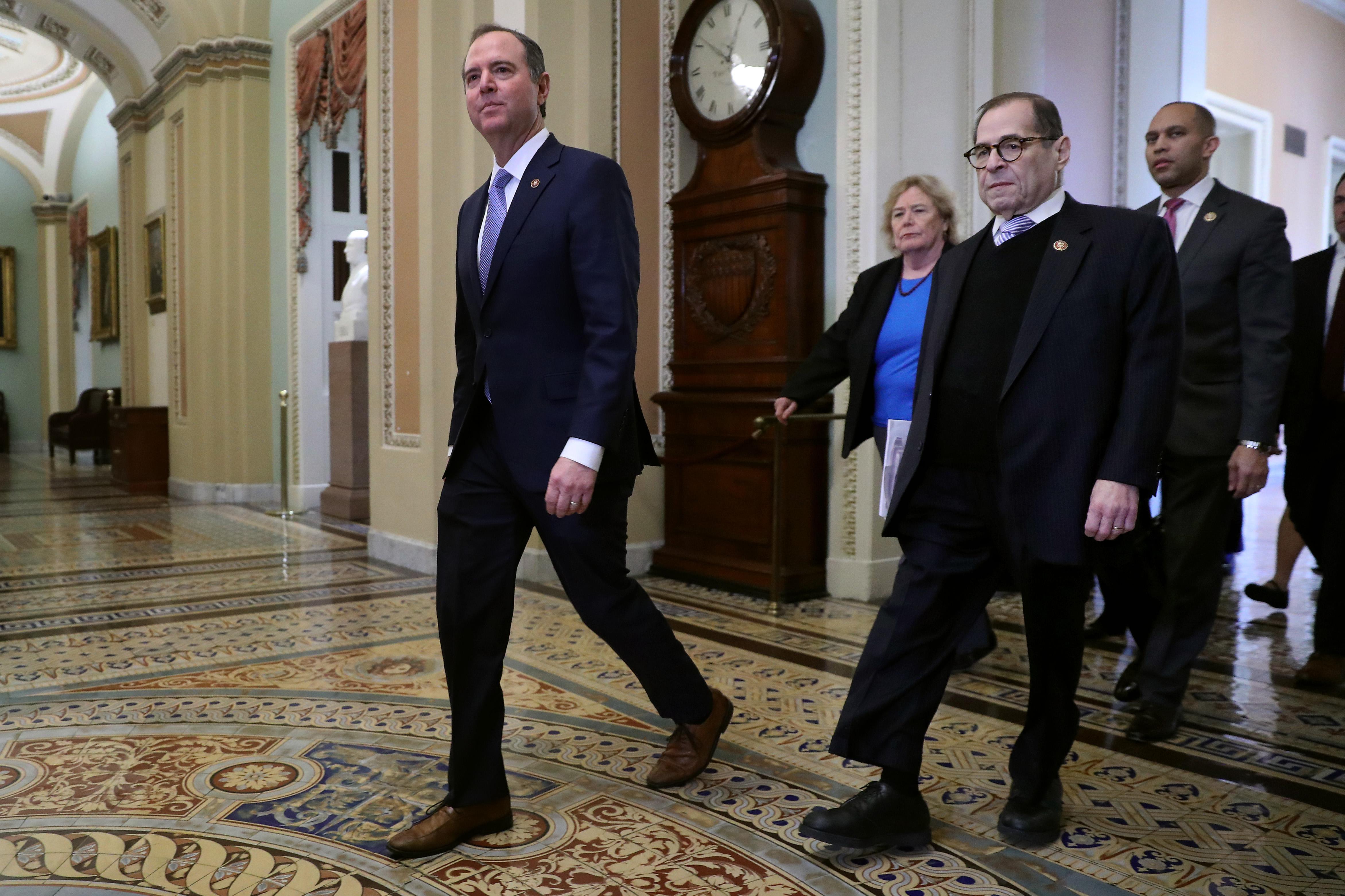 Rep. Adam Schiff (D-CA) strides across the Capitol floor outside the Senate chamber, followed by Rep. Zoe Lofgren (D-CA), Rep. Jerrold Nadler (D-NY) and Rep. Hakeem Jeffries (D-NY).
