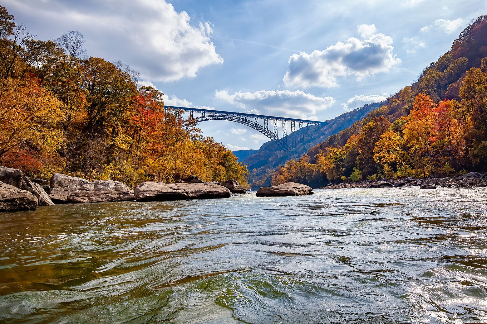 A high bridge over a West Virginia river is seen in autumn. 