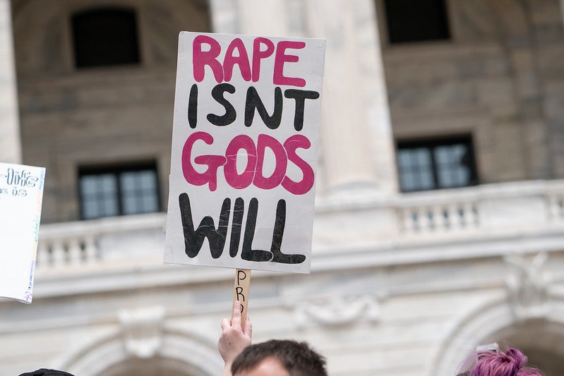 A sign that says "rape isn't God's will."